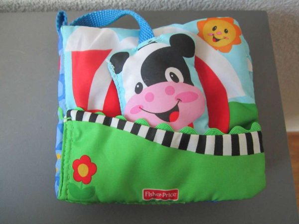 Livre en tissu avec vache amovible avec grelot (env. 13 cm)