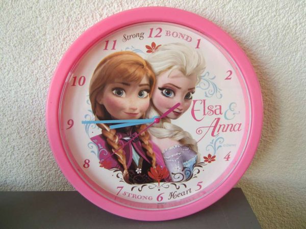 Horloge murale Reine des neiges rose (diamètre env. 24 cm)