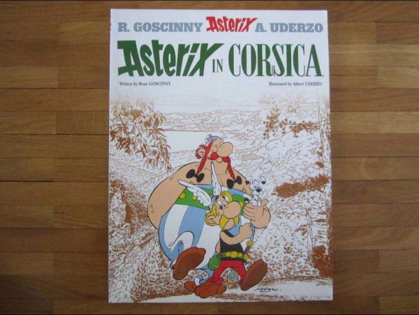 BD souple en anglais "Asterix in Corsica" (en bon état).